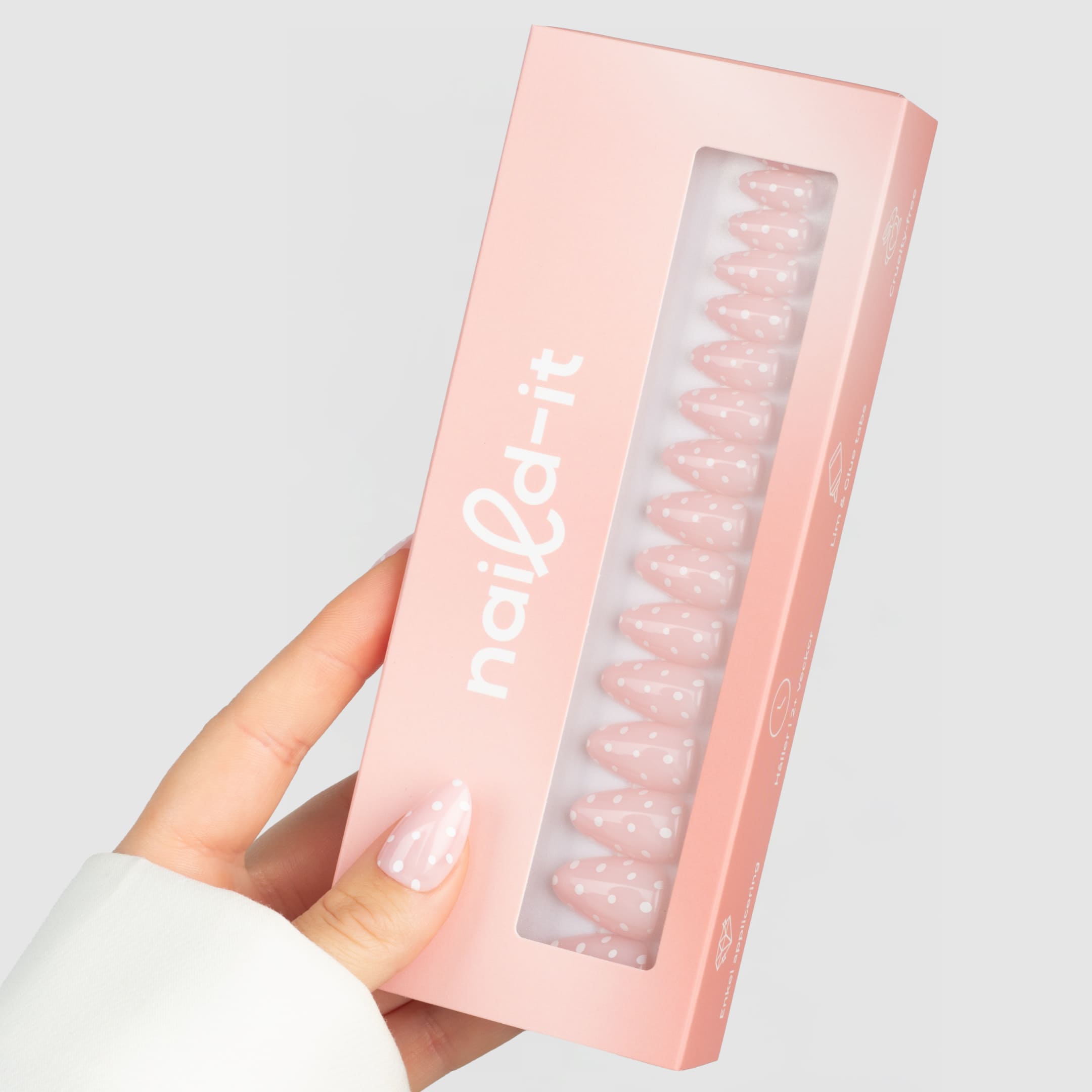 Rosa prickiga press-on naglar i almond-form med glansig finish.