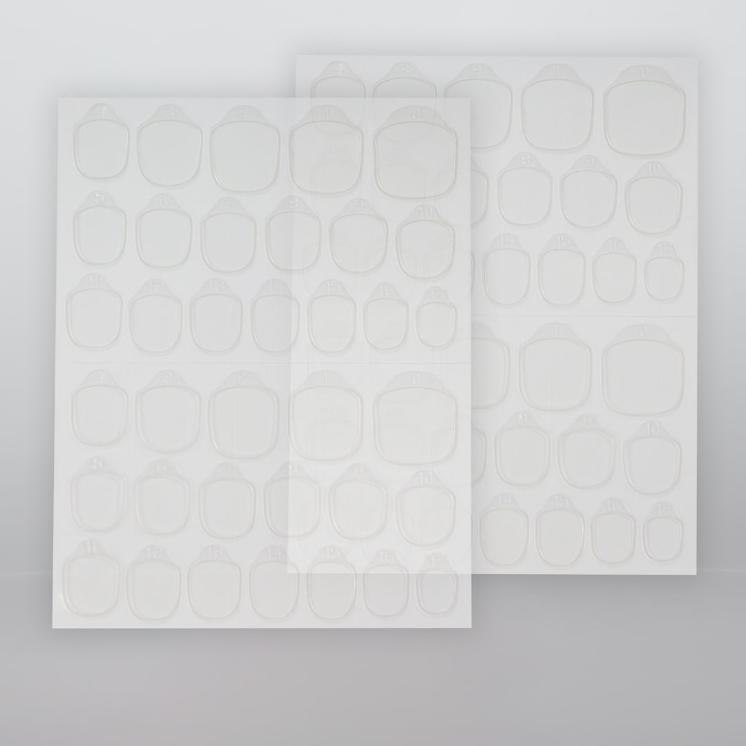 Glue tabs i 10-pack som tillbehör för flexibel applicering och återanvändning av press-on lösnaglar